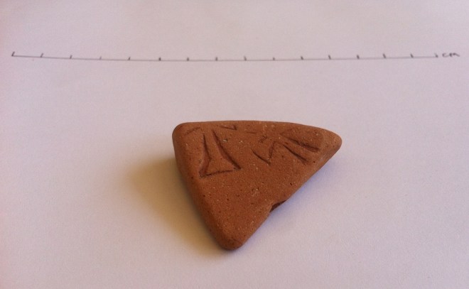 Pottery sherd with partial cross design